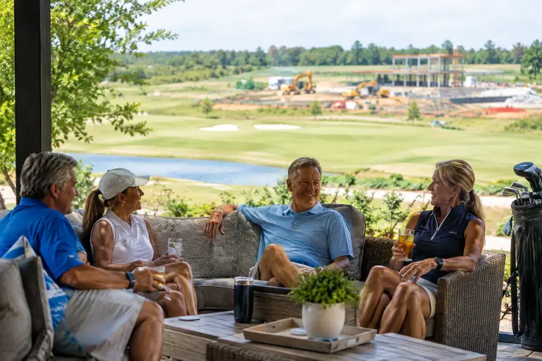Private club golf course under construction with shaped sand areas and fairway edges